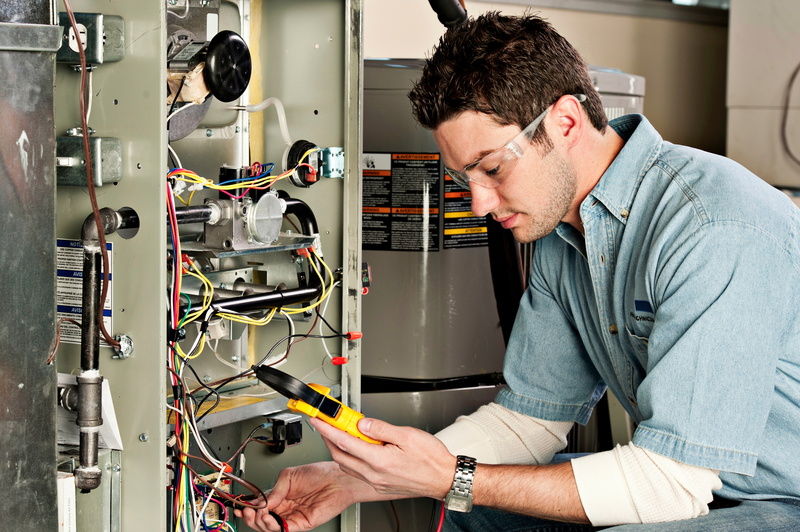 Technician testing a furnace